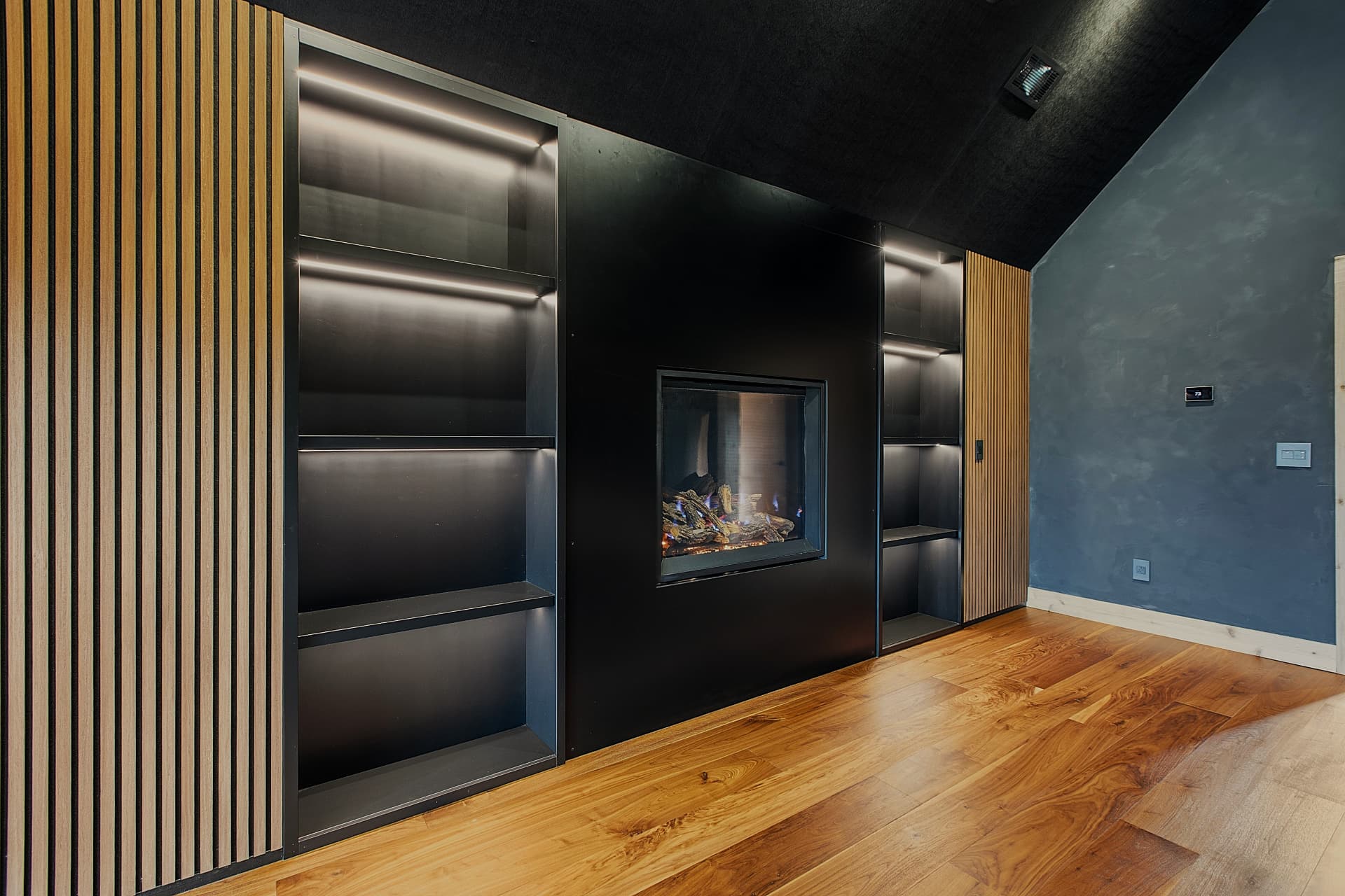 Custom built-in shelving with fireplace surround